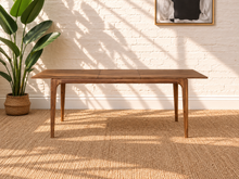 Load image into Gallery viewer, Cody extendable dining table in natural hazelnut brown acacia wood with rounded corners, curved legs and integrated butterfly extension.
