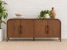 Load image into Gallery viewer, Collin four-door dark walnut media cabinet with rounded upper corners, integrated wood pulls and slim solid wood legs.
