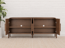 Load image into Gallery viewer, Collin four-door dark walnut media cabinet with rounded upper corners, integrated wood pulls and slim solid wood legs.

