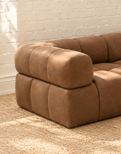 Load image into Gallery viewer, Colton four-piece sectional sofa in mocha brown genuine leather with rounded backrests, plush foam seating and sculptural channel-style upholstery.
