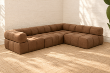 Load image into Gallery viewer, Colton four-piece sectional sofa in mocha brown genuine leather with rounded backrests, plush foam seating and sculptural channel-style upholstery.
