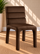 Load image into Gallery viewer, Conrad upholstered dining chair in Espresso velvet with deep channel-tufted back and sculptural upholstered frame
