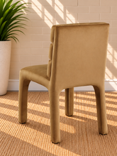 Load image into Gallery viewer, Conrad upholstered dining chair in Honey Cognac velvet with deep channel-tufted back and sculptural frame
