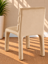 Load image into Gallery viewer, Conrad upholstered dining chair in Vanilla Sand velvet with deep channel-tufted back and sculptural upholstered frame
