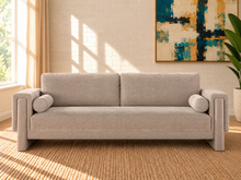 Load image into Gallery viewer, Corinne sofa in Greige chenille fabric with two back cushions, matching bolster pillows, structured arms, and contemporary design.
