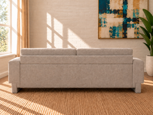 Load image into Gallery viewer, Corinne sofa in Greige chenille fabric with two back cushions, matching bolster pillows, structured arms, and contemporary design.

