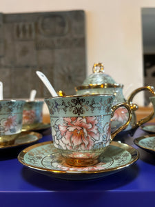 Six piece tea set with spoons and saucers