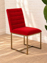 Load image into Gallery viewer, Dakota dining chair upholstered in red-orange velvet with horizontal channel ladder back and brushed gold stainless steel legs.
