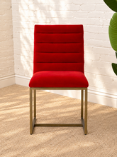 Load image into Gallery viewer, Dakota dining chair upholstered in red-orange velvet with horizontal channel ladder back and brushed gold stainless steel legs.
