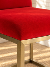 Load image into Gallery viewer, Dakota dining chair upholstered in red-orange velvet with horizontal channel ladder back and brushed gold stainless steel legs.
