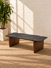 Load image into Gallery viewer, Damian solid acacia wood coffee table with a charcoal rectangular top, rounded edges, and natural brown panel-style supports.
