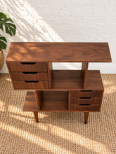 Load image into Gallery viewer, Mid-century modern walnut room divider with asymmetrical open shelving, six drawers, sculpted finger pulls, and tapered legs.
