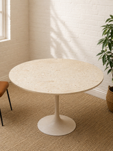 Load image into Gallery viewer, Vintage round travertine dining table with creamy natural stone top and sculptural white tulip pedestal base.
