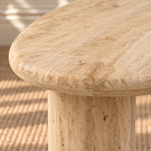 Load image into Gallery viewer, Eisley beige travertine freeform coffee table with three cylindrical pedestal legs and natural stone variation.
