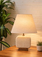 Load image into Gallery viewer, Image 2 of 6: Elio natural travertine table lamp with linen-textured shade and walnut wood base
