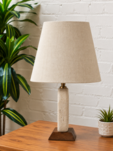 Load image into Gallery viewer, Image 3 of 6: Elio natural travertine table lamp with linen-textured shade and walnut wood base
