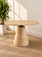 Load image into Gallery viewer, Elise Warm Sand solid mango wood round dining table with tapered pedestal base and contrasting black metal neck
