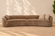 Load image into Gallery viewer, Ellie mocha beige curved two-piece sectional sofa with rounded arms, tight upholstered seat and back, and three coordinating throw pillows.
