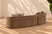 Load image into Gallery viewer, Ellie mocha beige curved two-piece sectional sofa with rounded arms, tight upholstered seat and back, and three coordinating throw pillows.
