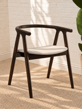 Load image into Gallery viewer, Ellis light gray vegan leather dining chair with dark elm wood frame, curved back, integrated arms, and splayed legs
