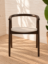 Load image into Gallery viewer, Ellis light gray vegan leather dining chair with dark elm wood frame, curved back, integrated arms, and splayed legs
