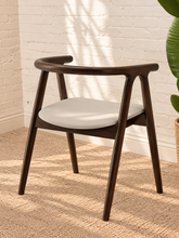 Load image into Gallery viewer, Ellis light gray vegan leather dining chair with dark elm wood frame, curved back, integrated arms, and splayed legs
