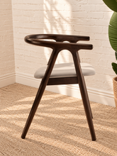 Load image into Gallery viewer, Ellis light gray vegan leather dining chair with dark elm wood frame, curved back, integrated arms, and splayed legs
