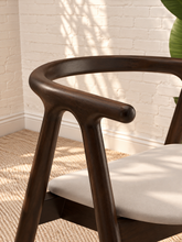 Load image into Gallery viewer, Ellis light gray vegan leather dining chair with dark elm wood frame, curved back, integrated arms, and splayed legs

