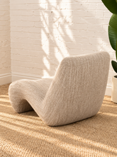 Load image into Gallery viewer, Emely ivory beige upholstered accent chair with textured fabric, armless sculptural wave silhouette and curved tight back.
