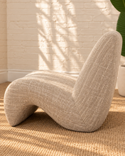 Load image into Gallery viewer, Emely ivory beige upholstered accent chair with textured fabric, armless sculptural wave silhouette and curved tight back.
