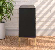Load image into Gallery viewer, Eva midnight bar cabinet with dimensional sunburst doors, long gold handles, gold metal base, and tapered legs
