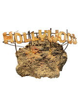Load image into Gallery viewer, Miniature Copper Hollywood Sign on Volcanic Rock
