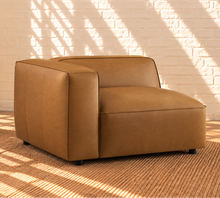 Load image into Gallery viewer, Florence caramel vegan leather four-piece modular sectional sofa with wide arms and square ottoman
