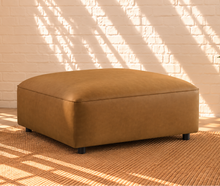 Load image into Gallery viewer, Florence caramel vegan leather four-piece modular sectional sofa with wide arms and square ottoman
