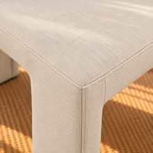 Load image into Gallery viewer, Foley upholstered dining chair in Ivory linen-textured fabric with sculptural fully upholstered frame
