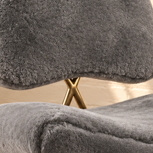 Load image into Gallery viewer, Freya soft gray furry lounge chair with curved padded seat and polished gold metal toothpick legs
