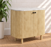 Load image into Gallery viewer, Frida sand mango wood bar cabinet with curved fluted doors, black knobs, rounded legs, and white marble top
