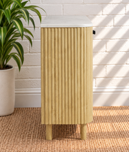 Load image into Gallery viewer, Frida sand mango wood bar cabinet with curved fluted doors, black knobs, rounded legs, and white marble top
