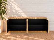 Load image into Gallery viewer, Gloria 4-Door Buffet Credenza in Radiant Gold with intricate hand-carved starburst doors and sculptural ridged detailing
