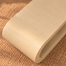 Load image into Gallery viewer, Gracielle Natural Oak coffee table with rounded continuous edges, elongated open center shelf, and sculptural contemporary design.

