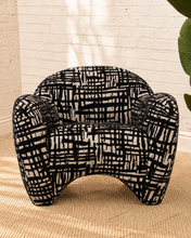 Load image into Gallery viewer, Hadley black and beige patterned upholstered accent chair with rounded arms, curved back and sculptural arched base.
