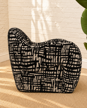 Load image into Gallery viewer, Hadley black and beige patterned upholstered accent chair with rounded arms, curved back and sculptural arched base.
