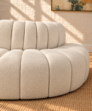 Load image into Gallery viewer, Hampton 4-piece sectional sofa in Creamy White boucle with deep channel tufting, rounded edges, curved seating, and contemporary modular design.
