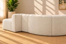 Load image into Gallery viewer, Hampton 4-piece sectional sofa in Creamy White boucle with deep channel tufting, rounded edges, curved seating, and contemporary modular design.
