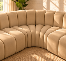 Load image into Gallery viewer, Hampton 8-piece arc sectional sofa in Honey Beige velvet with deep channel tufting and a sweeping curved modular configuration.
