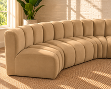 Load image into Gallery viewer, Hampton 8-piece arc sectional sofa in Honey Beige velvet with deep channel tufting and a sweeping curved modular configuration.
