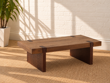 Load image into Gallery viewer, Hayden coffee table in natural brown mango wood with a rectangular top, rounded edges, visible joinery details, and broad panel-style legs.
