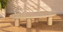 Load image into Gallery viewer, Henry Natural Blonde solid oak coffee table with organic rounded tabletop, four cylindrical wood legs, and visible natural oak grain.
