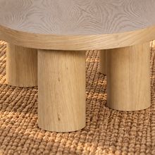 Load image into Gallery viewer, Henry Natural Blonde solid oak coffee table with organic rounded tabletop, four cylindrical wood legs, and visible natural oak grain.
