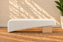 Load image into Gallery viewer, Hiera Blonde Oak dining bench upholstered in Cloud Ivory polyester fabric with sculptural wood base
